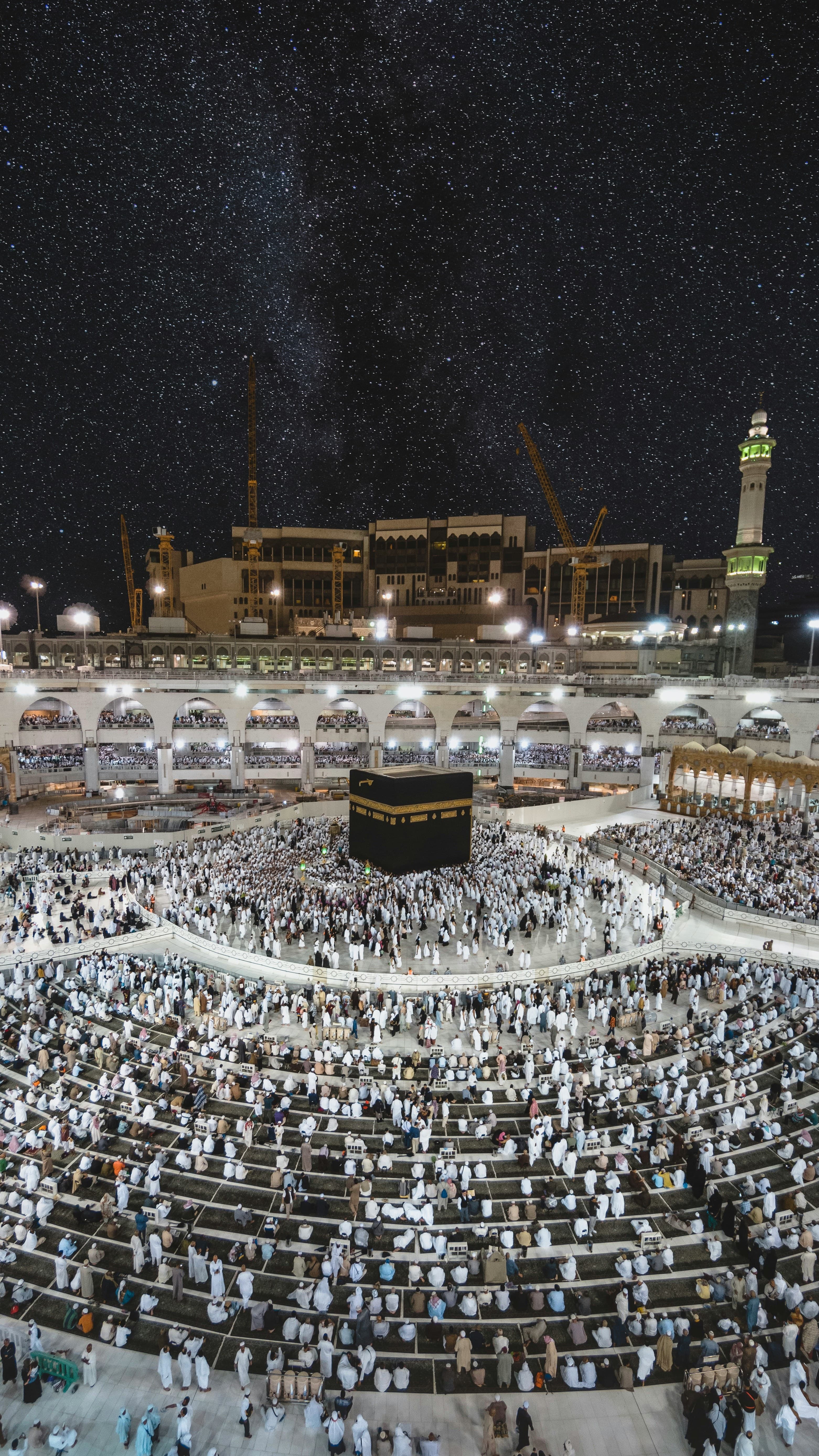 Al-Masjid an-Nabawi at dawn with its teal-toned minarets and courtyard